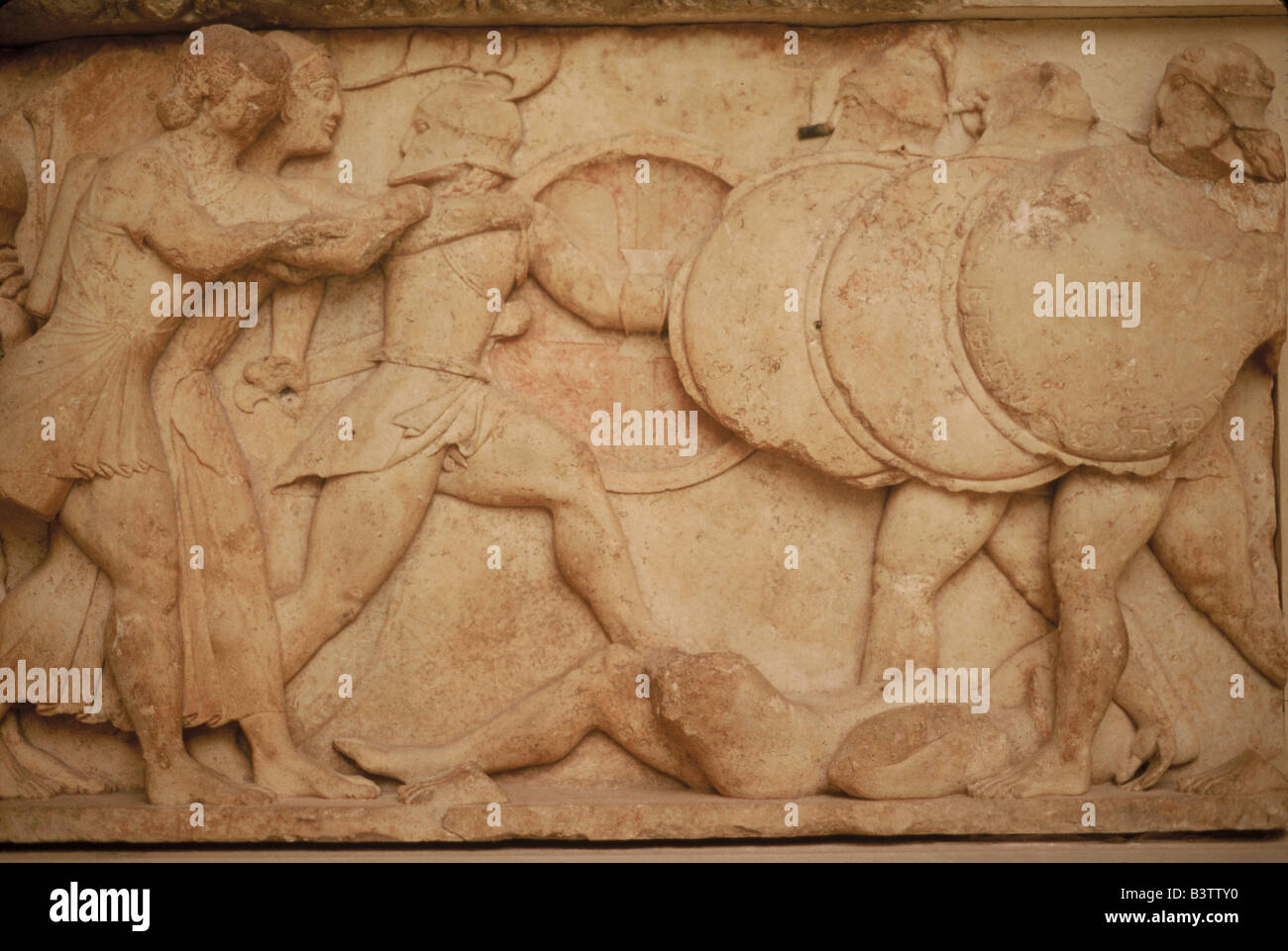 Greece, Delphi. Ancient warriors battle in this classical era decoration from the Treasury at Delphi, shown in the Delphi Museum Stock Photo