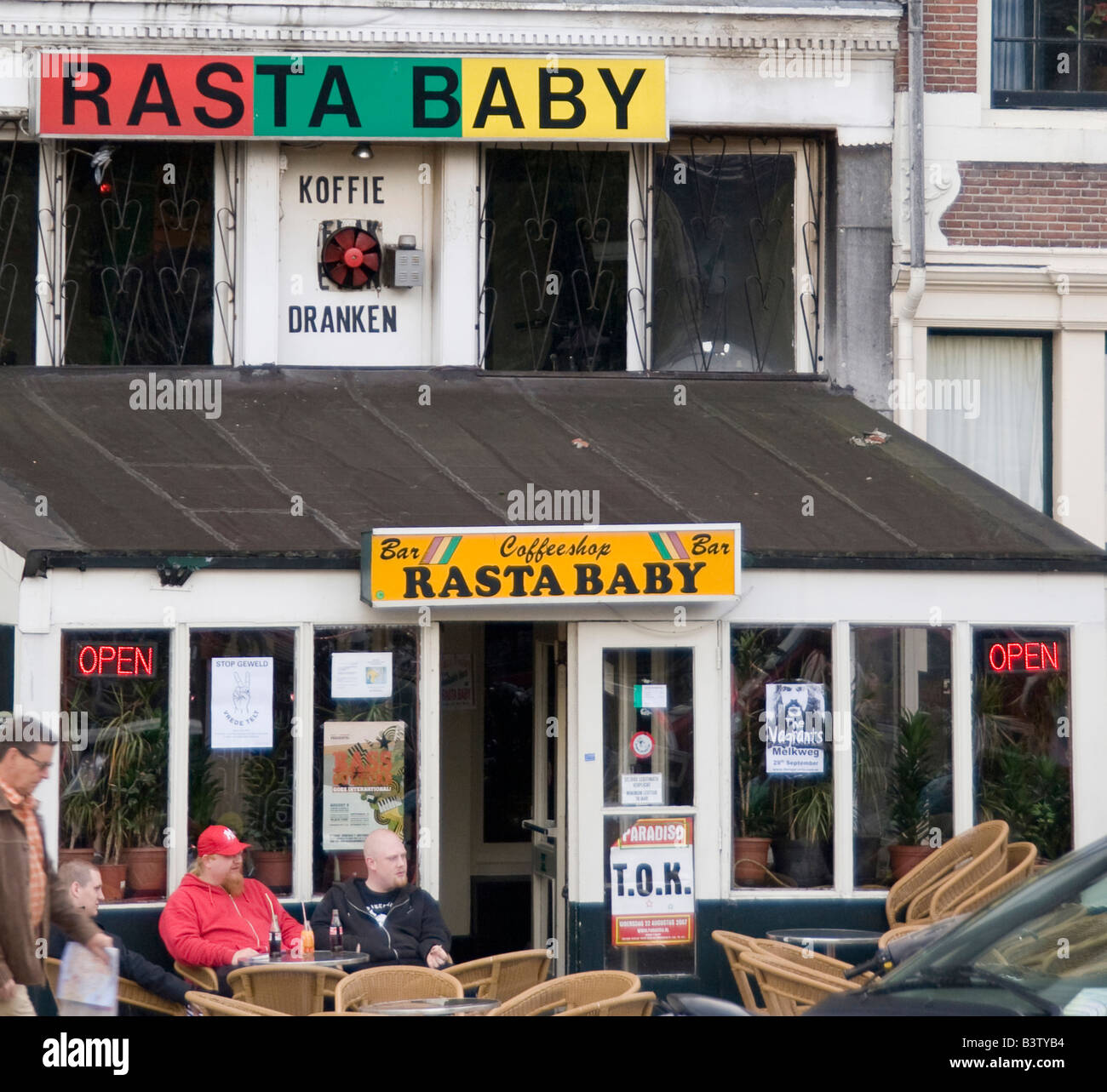 The colorful Rasta Baby CoffeeShop and patio with people Stock Photo