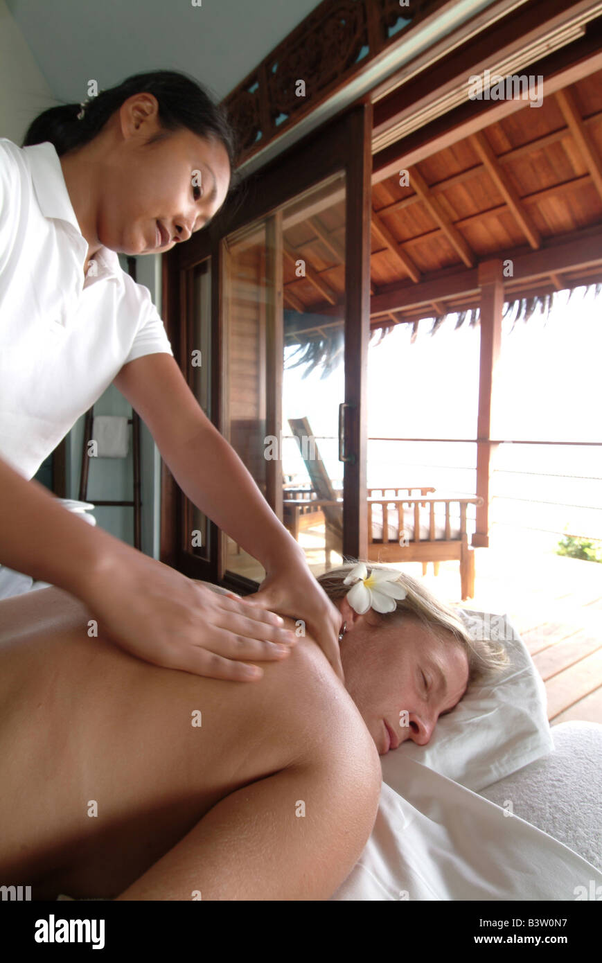A guest receives a massage at the Amrita Spa overlooking Guttles Beach Stock Photo