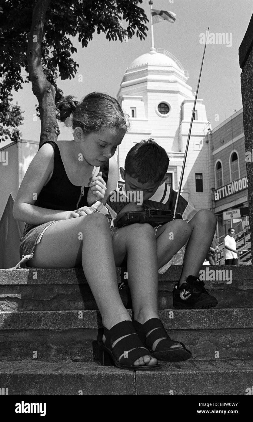 Young Arsenal fans listening to the game on a radio outside Wembley Stadium before the 1998 FA Cup Final against Newcastle Utd. Stock Photo