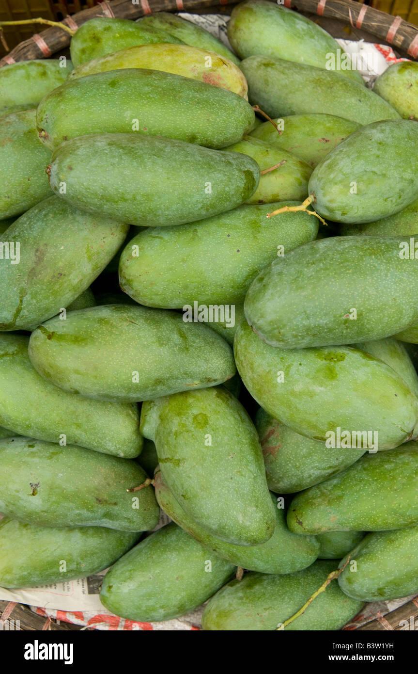 A close up of a basket of mangoes in a Vietnamese market Stock Photo