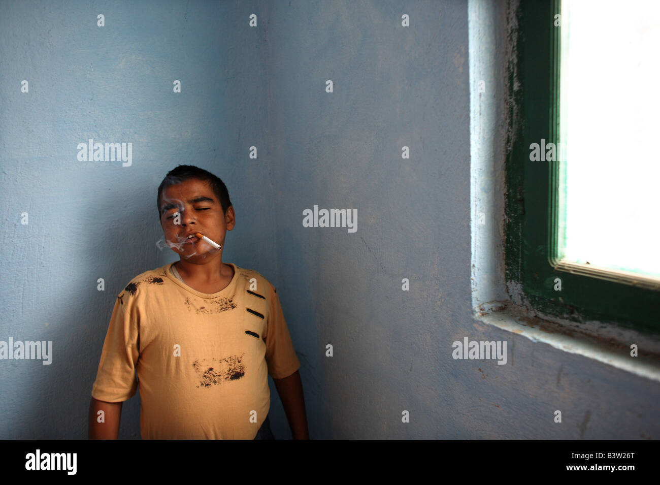 A 17 year old child prisoner smokes a cigarette in Vaqarr prison in Tirana the capital of Albania Stock Photo
