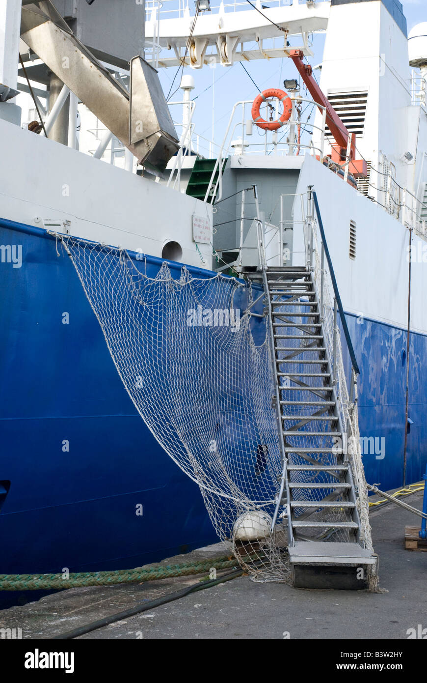 Gangway with handrails and safety net onto large 