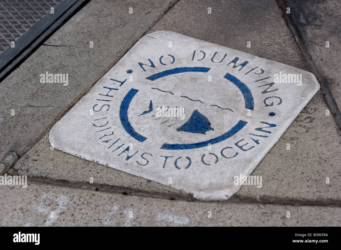 No dumping sign on pavement Stock Photo