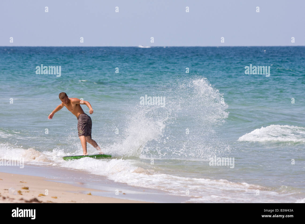 Skimboarder on skimboard, Fort Lauderdale, Florida, USA Stock Photo Alamy
