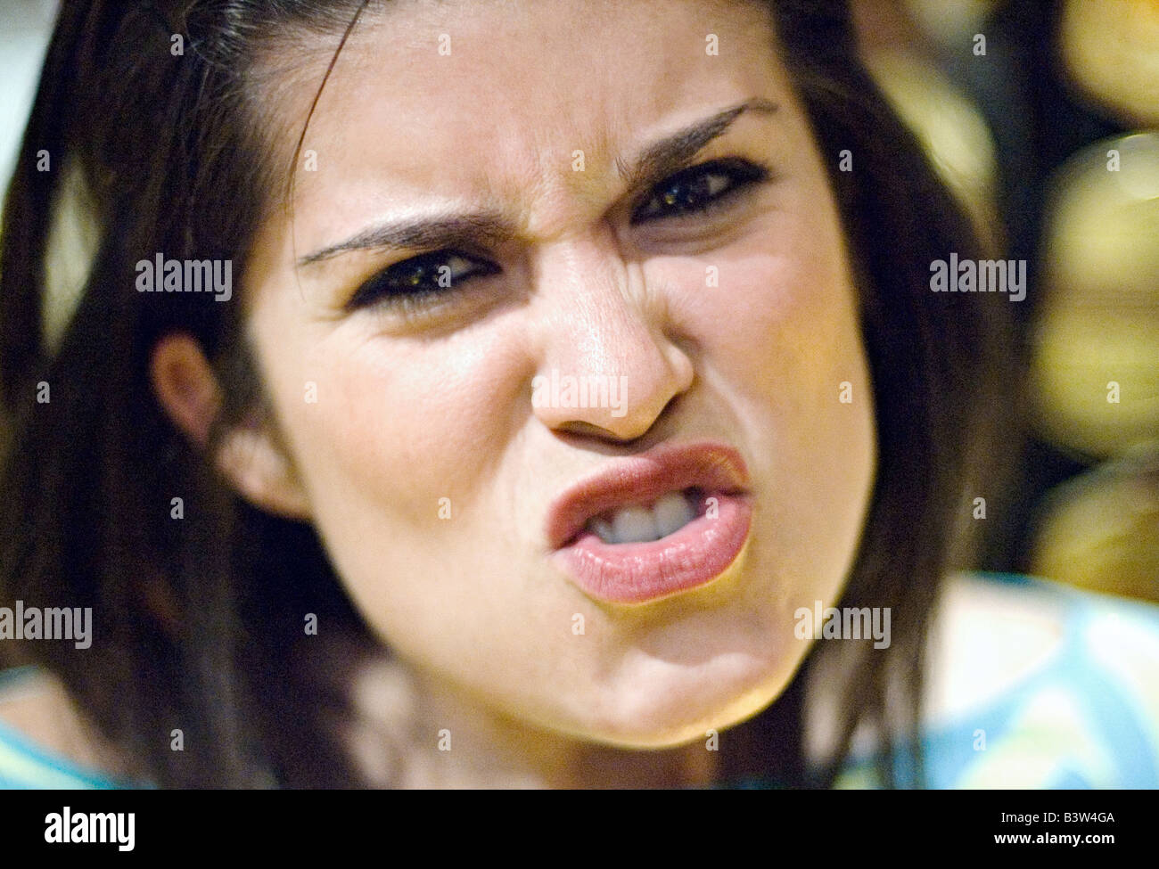 portrait of a young woman looking into camera Stock Photo - Alamy