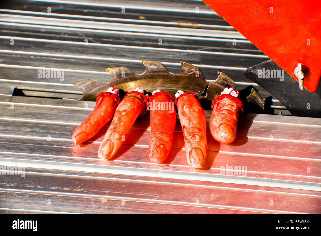 mutilated, sawn off fingers on a circular saw. Not real Stock Photo Alamy