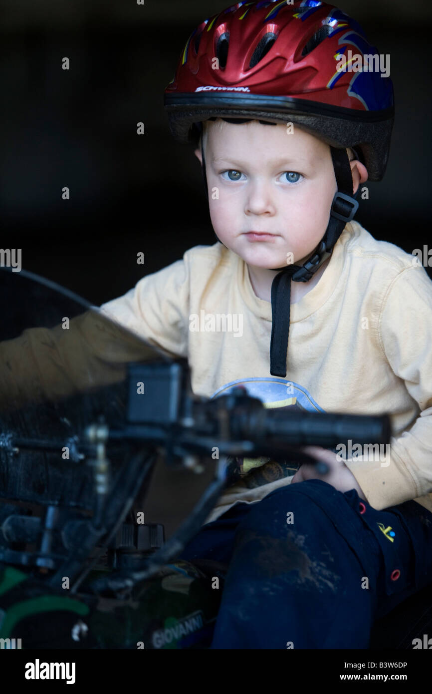 A young boy wearing a helmet Stock Photo Alamy