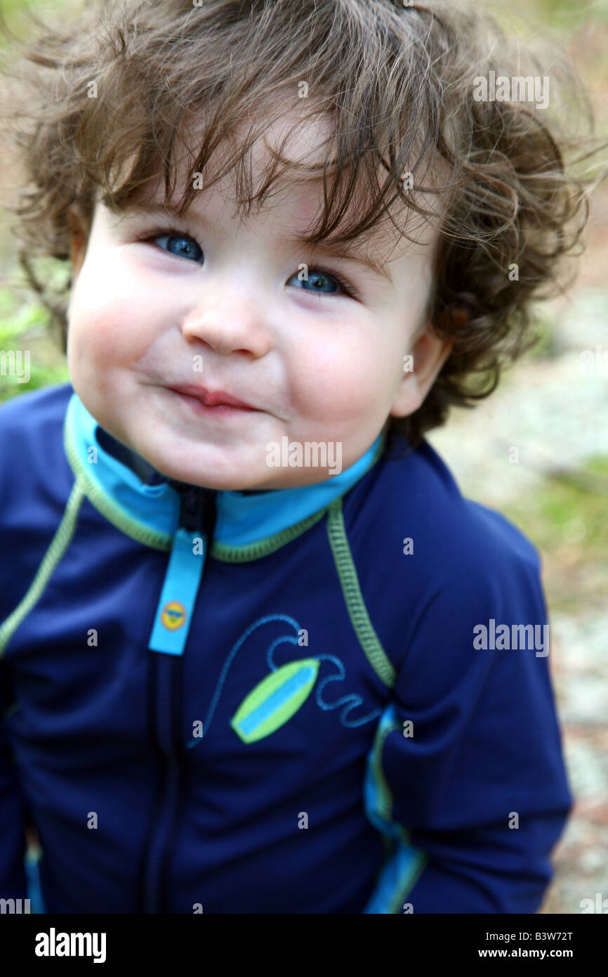 Portrait of blue-eyed baby boy smiling Stock Photo - Alamy