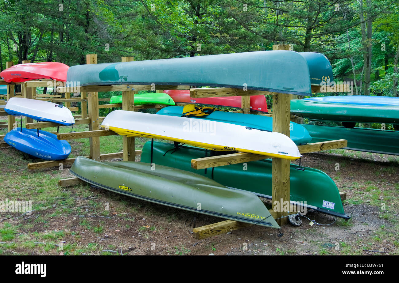 Canoes and kayaks on a rack Stock Photo - Alamy