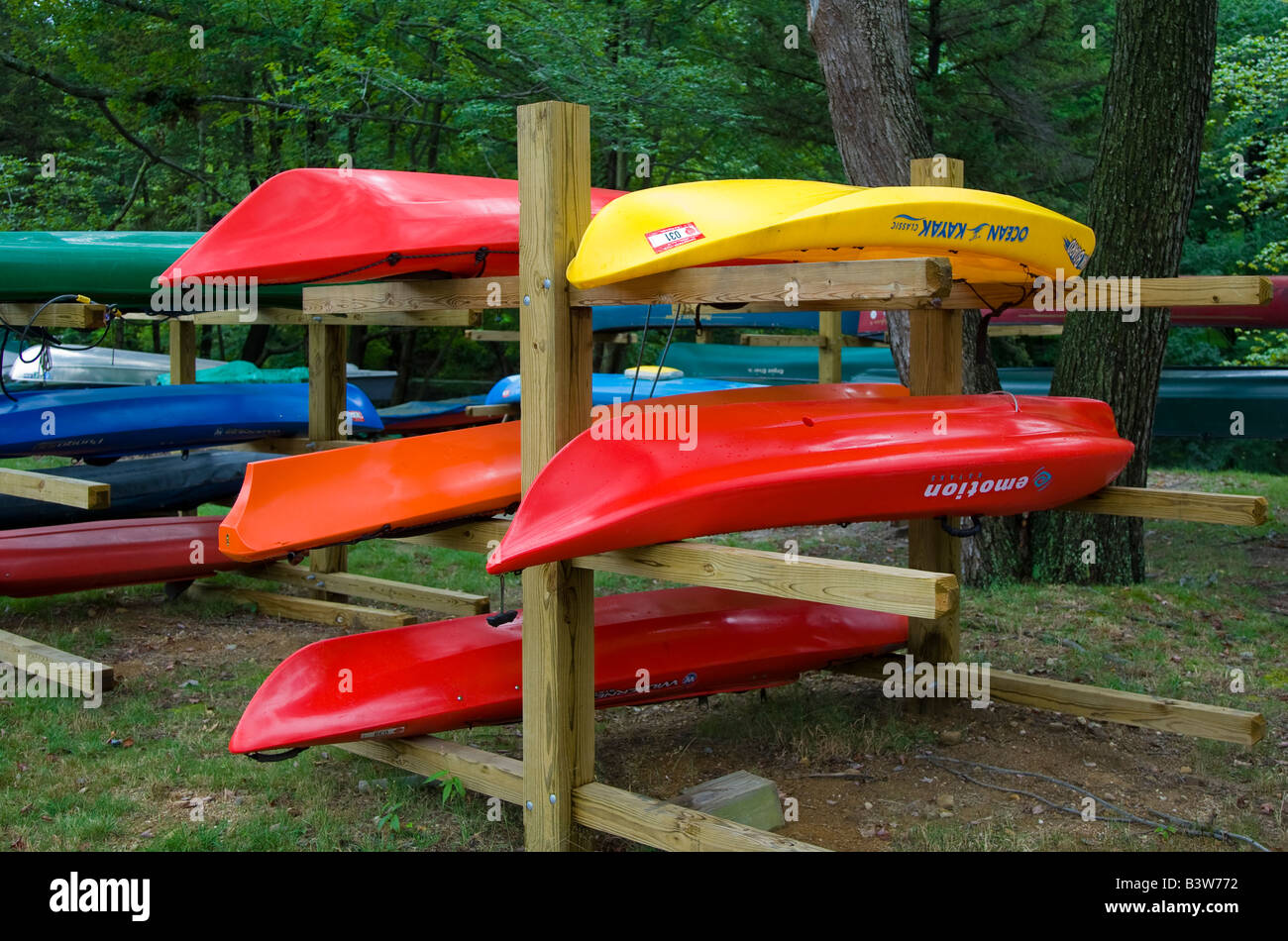 Canoes and kayaks on a rack Stock Photo - Alamy