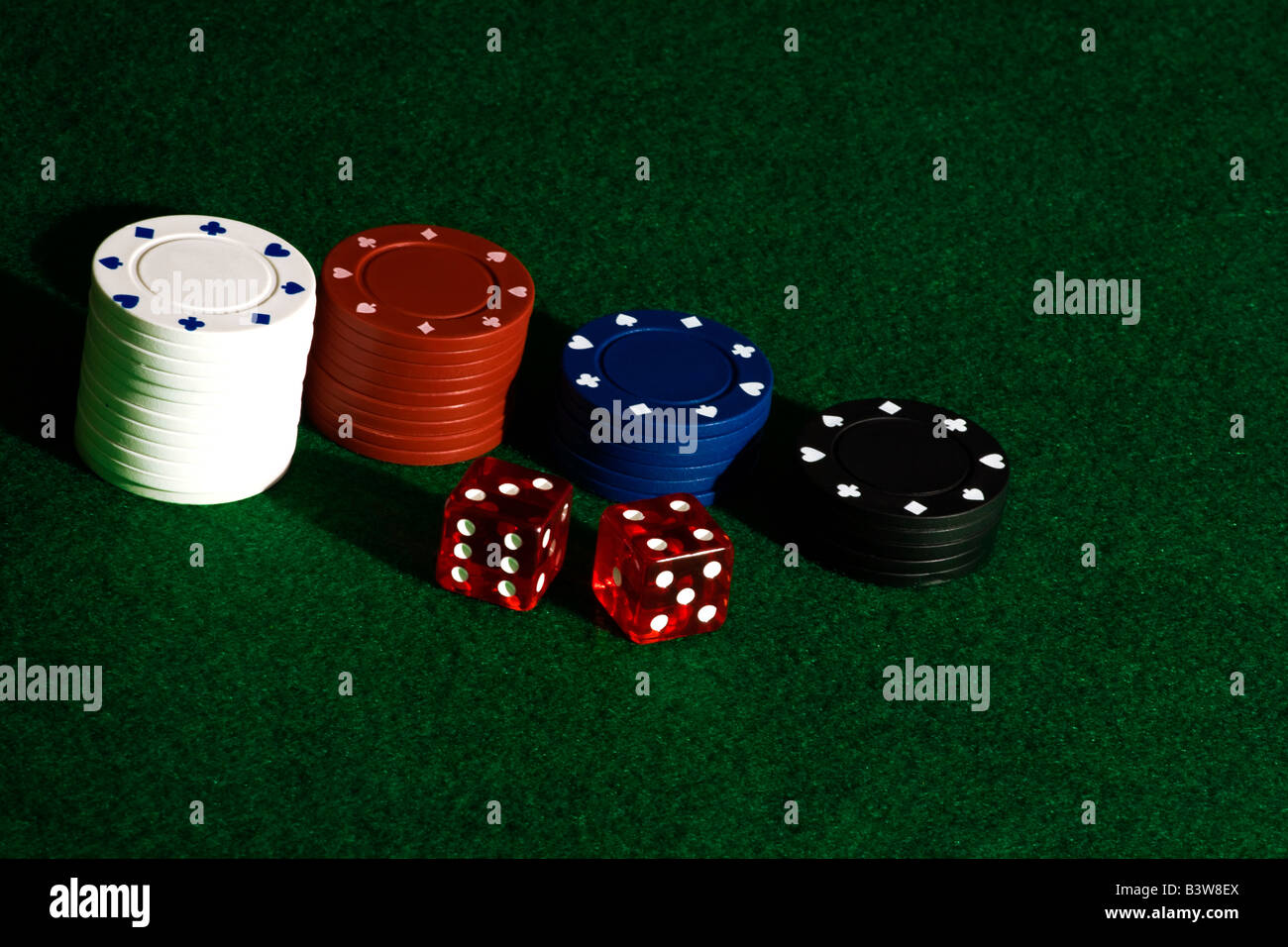 Poker chips and dice on felt Stock Photo Alamy