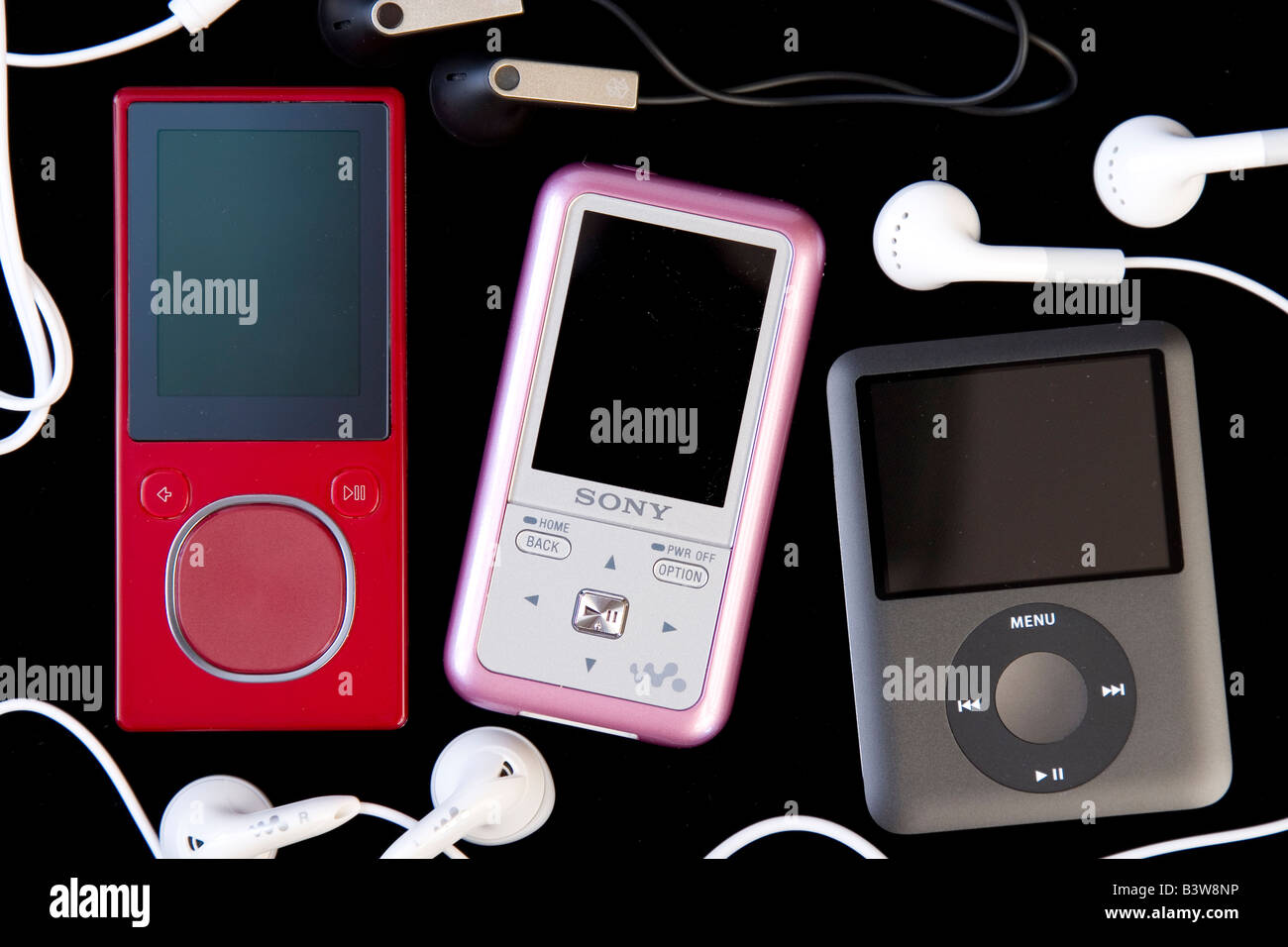 Studio shot of MP3 players: iPod, Sony Walkman, Zune Stock Studio shot of MP3 players: iPod, Sony Walkman, Zune Stock