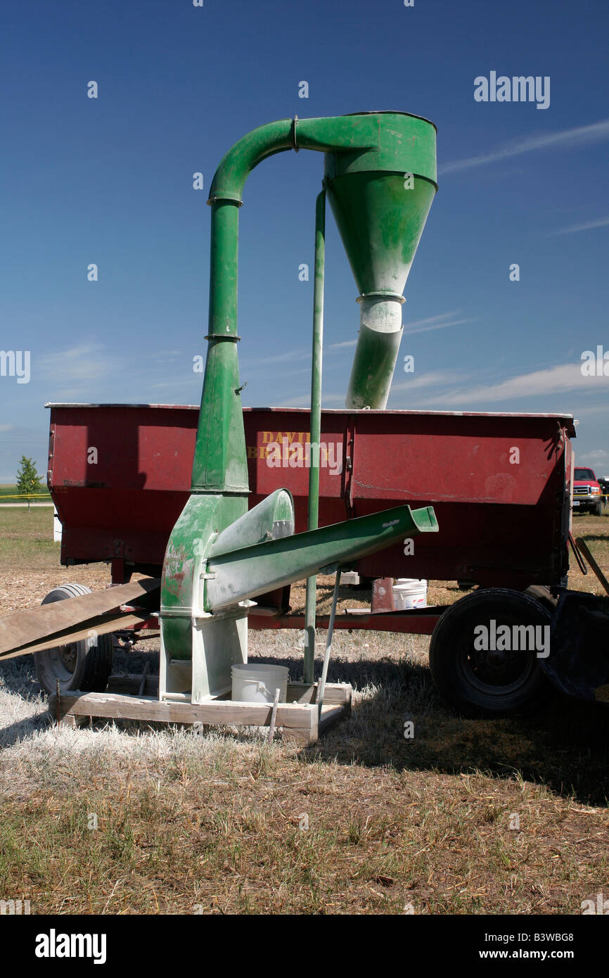 Belt driven hammer mill grinding animal feed Stock Photo Alamy