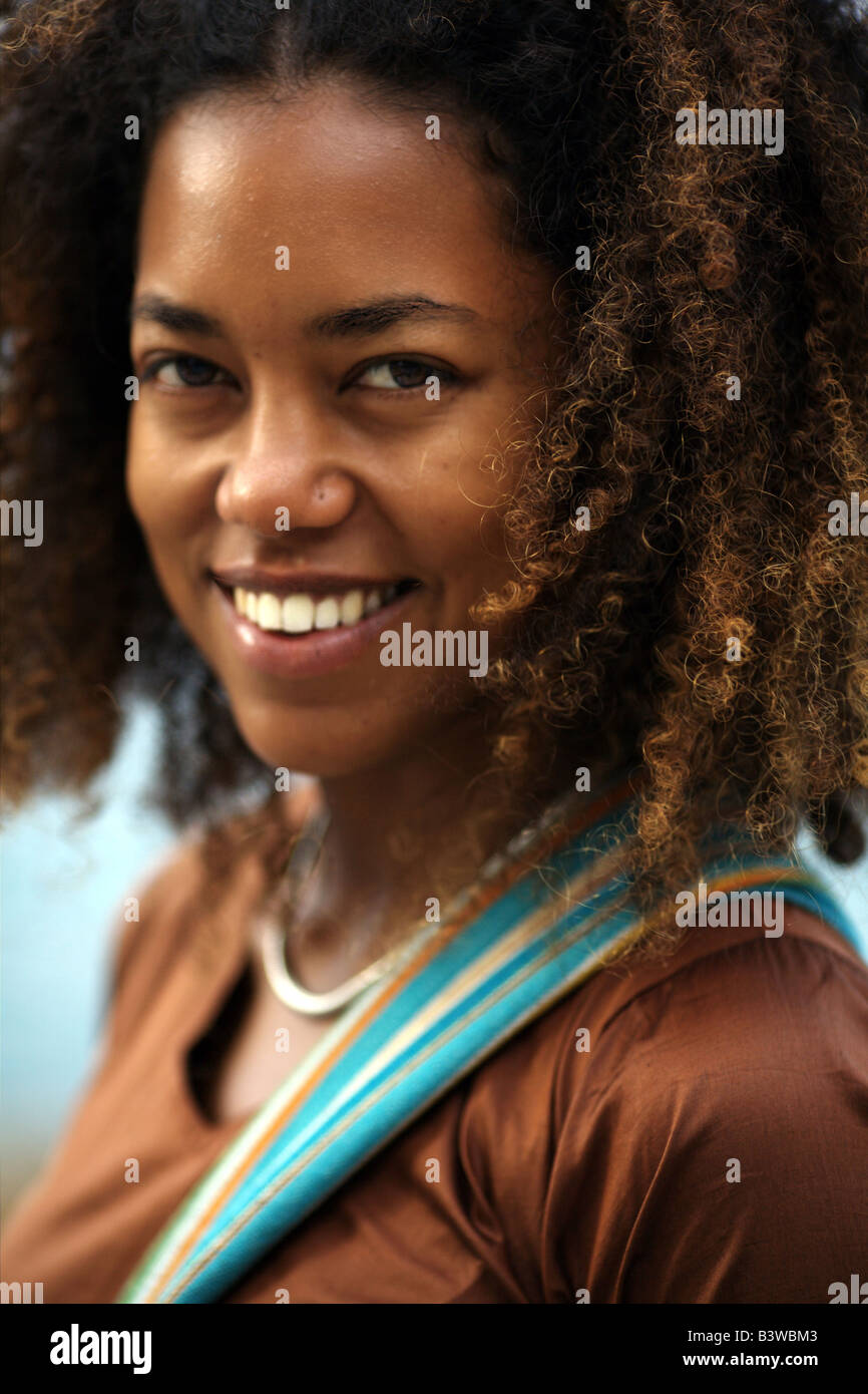 Headshot portrait of a young black lady looking straight at the camera Stock Photo