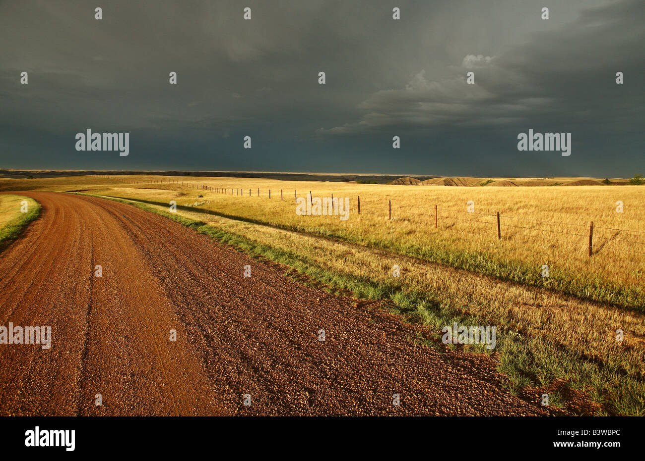 Storm clouds along a Saskatchewan country road Stock Photo - Alamy