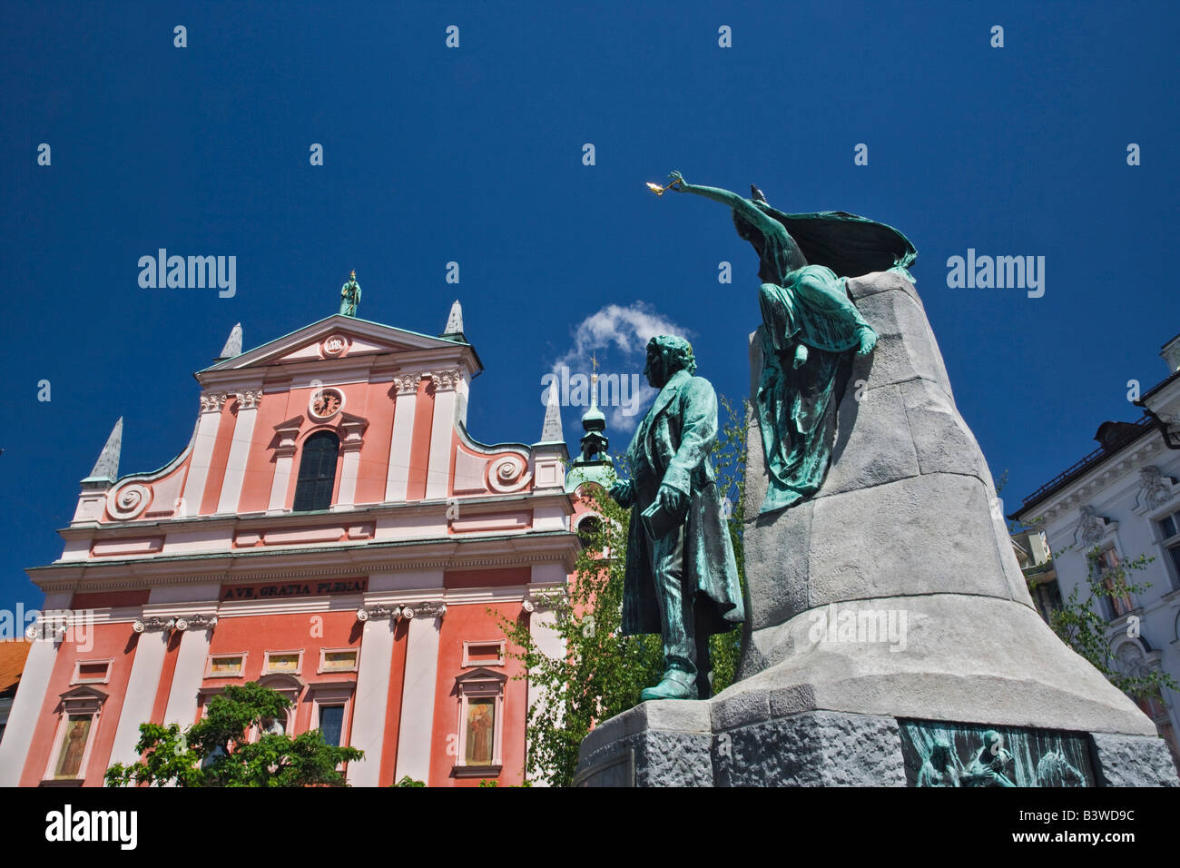 Statue of France Preseren, a Slovenian poet and national hero, and baroque-style Franciscan Church of the Annunciation of Mary, Stock Photo