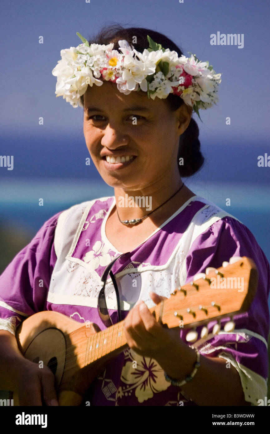 Oceania, French Polynesia, Taha'a. Female native musician playing
