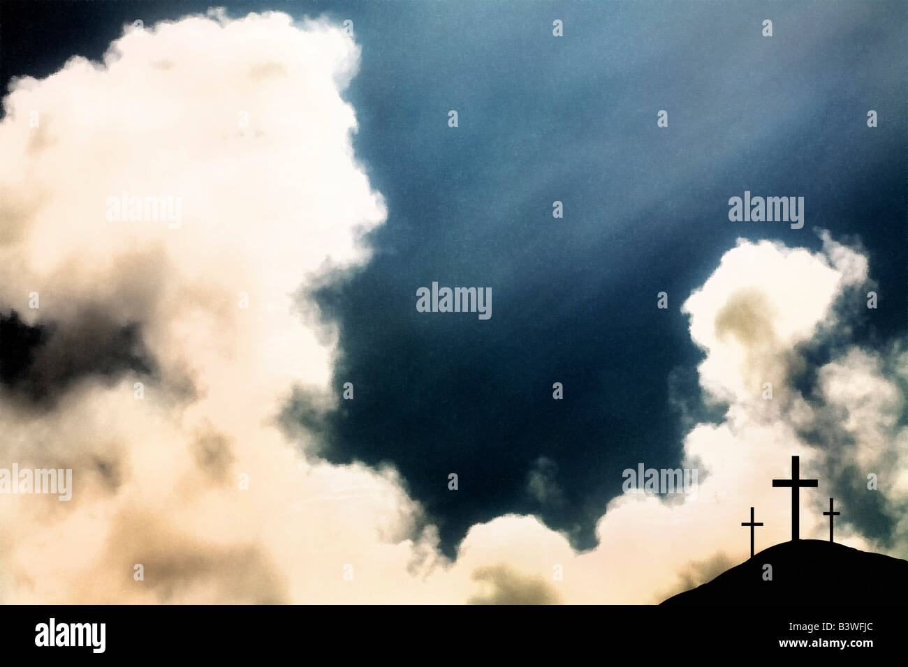 Three crosses on hill and dramatic clouds Stock Photo