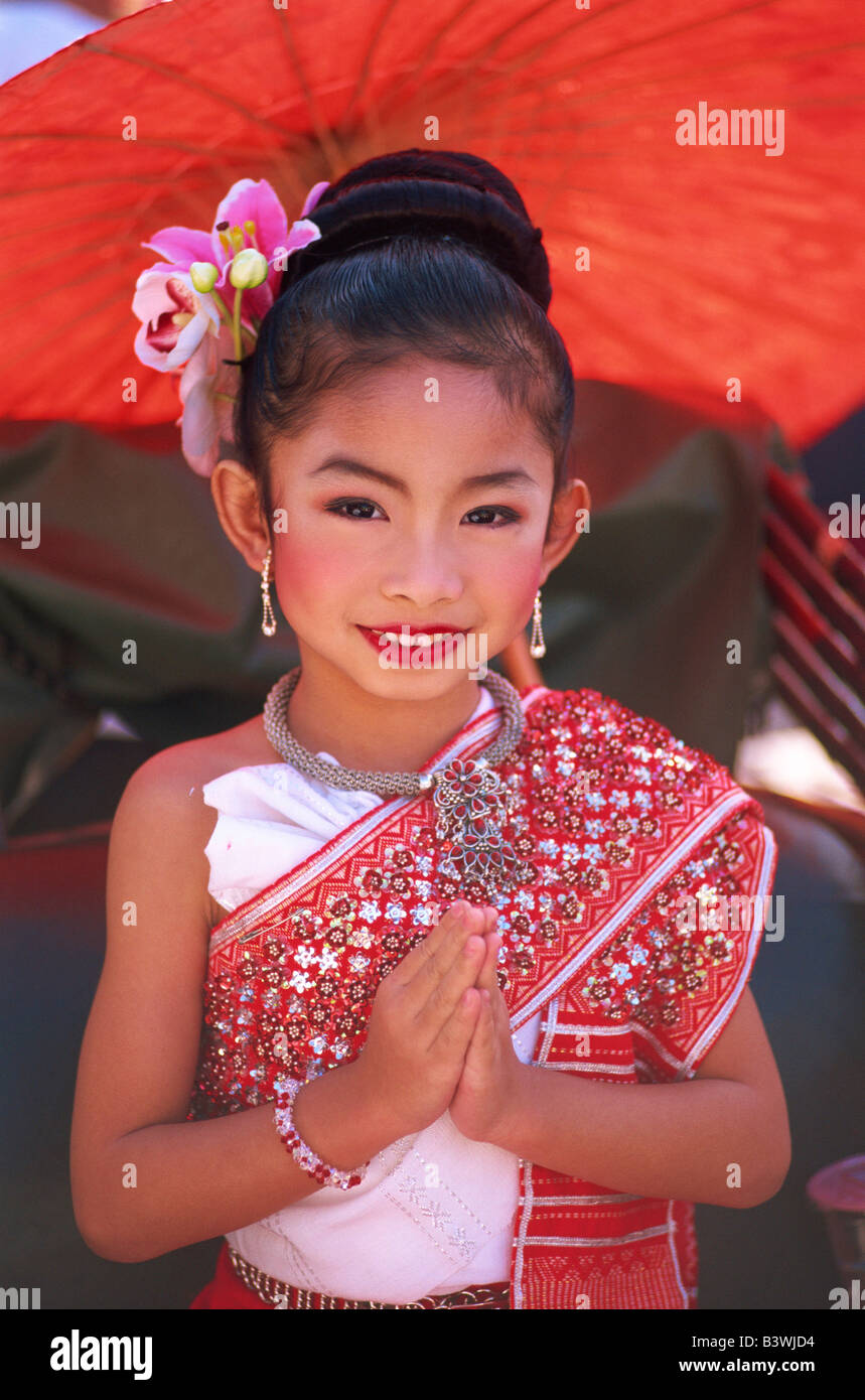 Portrait Girl In Traditional Thai Costume With Her Hands Folded At