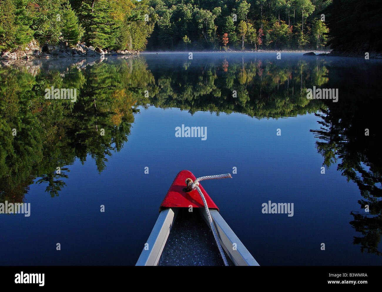 canoe on a calm lake Stock Photo