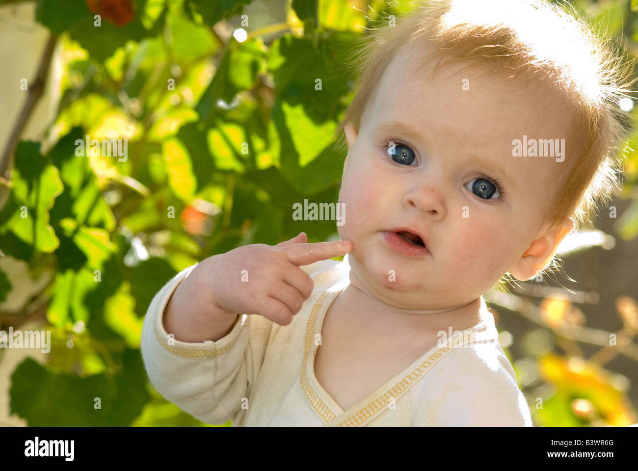 child with an idea, a thought, a question Stock Photo