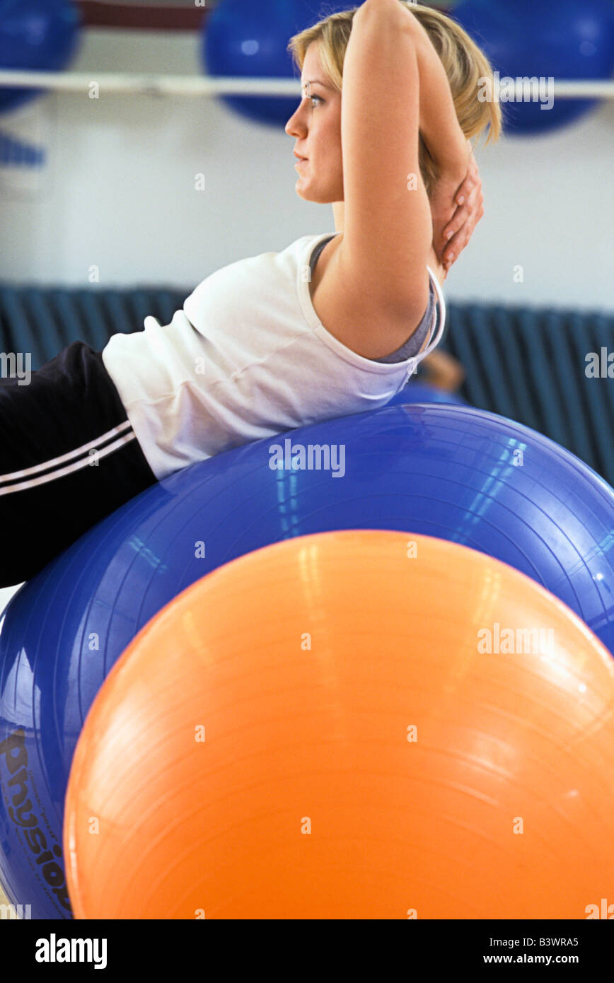 Woman Strengthening Core Muscles on Exercise Ball Stock Photo Alamy