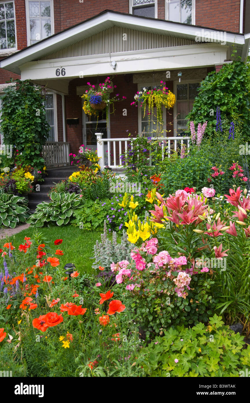 A Wolseley area home front yard and boulevard planted with spring flowers in Winnipeg, Manitoba