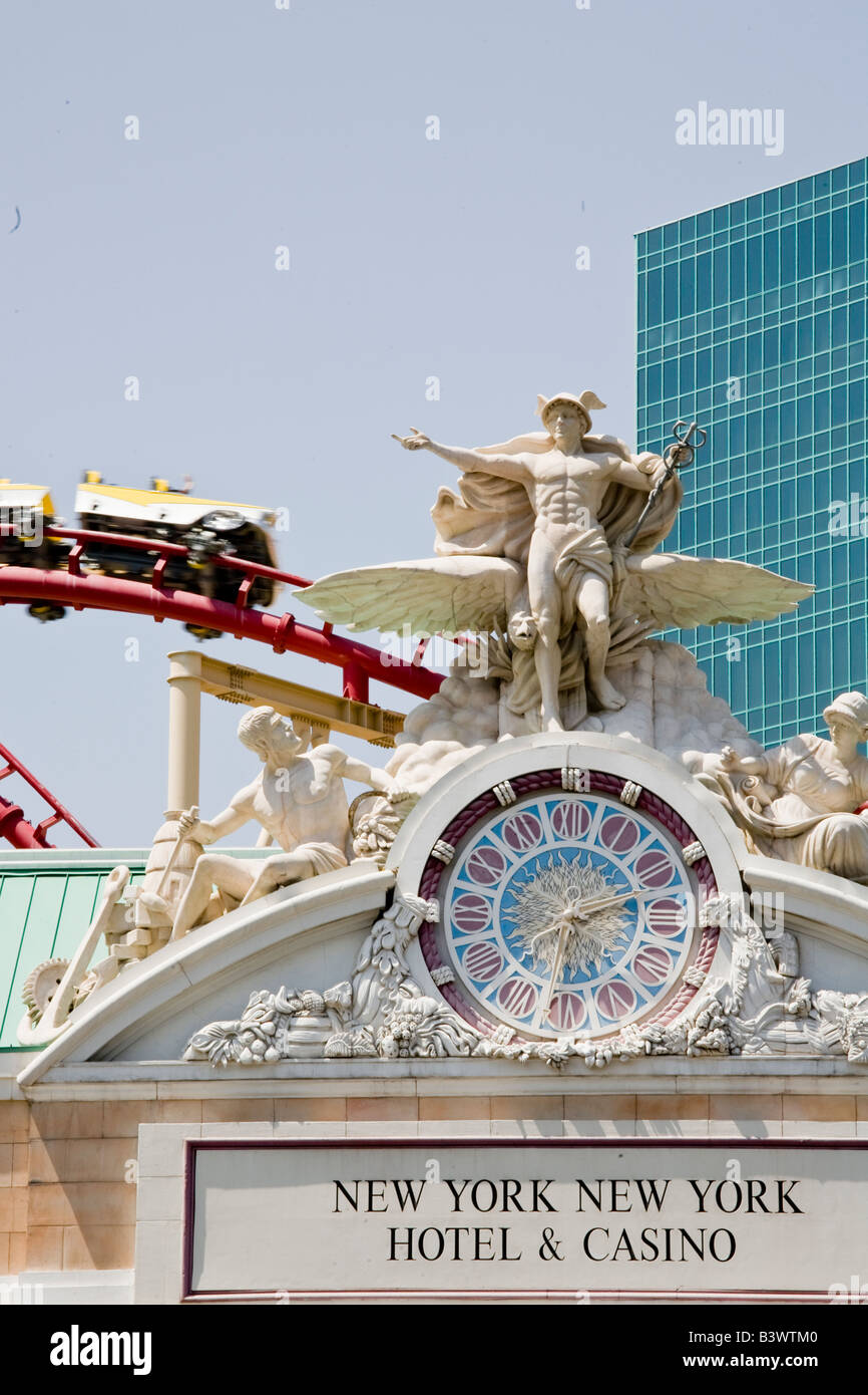 A roller coaster whisks passengers past the entrance to the New York
