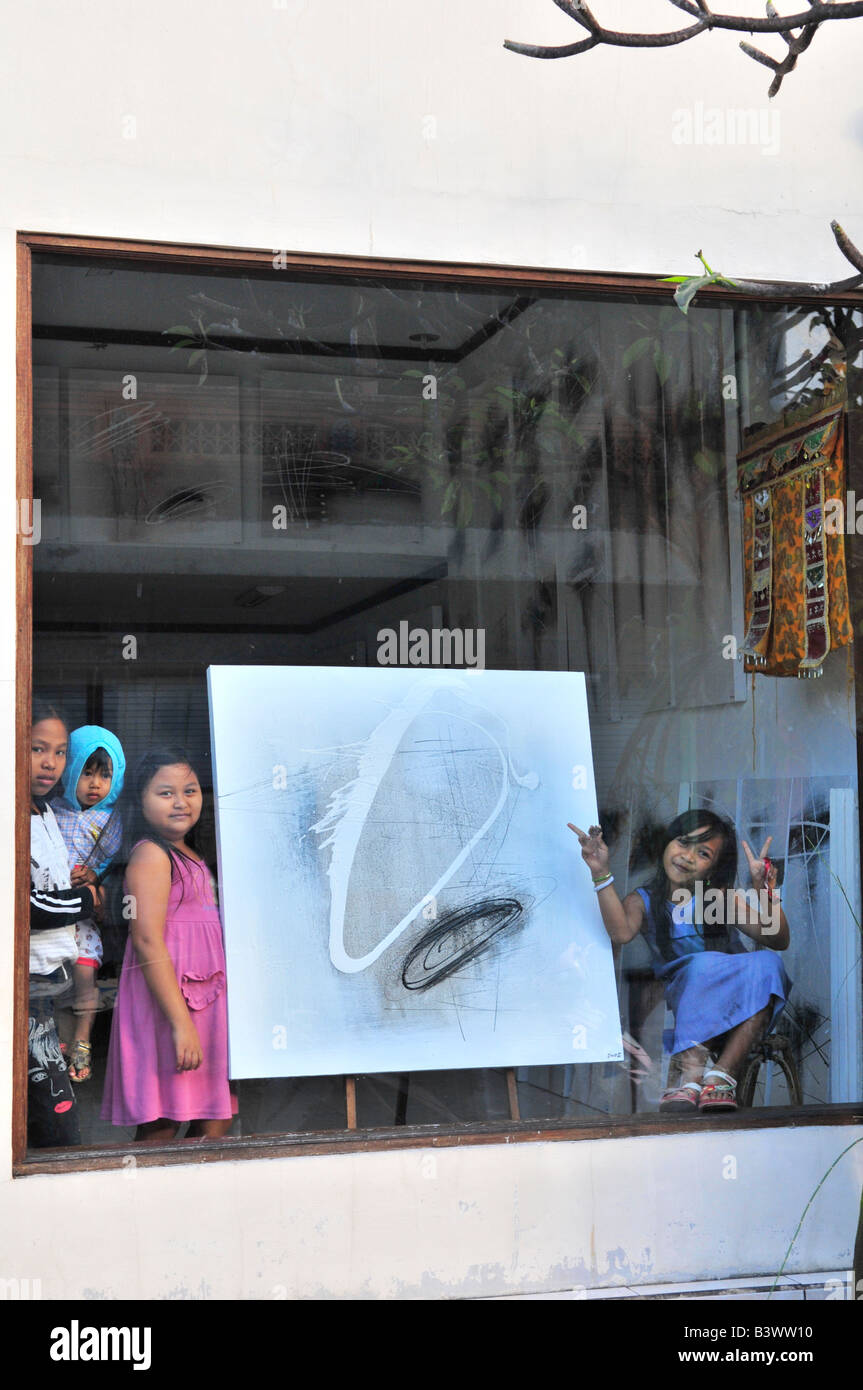 art shop in ubud , children being children, mischevious and funny,ubud , island of bali , indonesia Stock Photo
