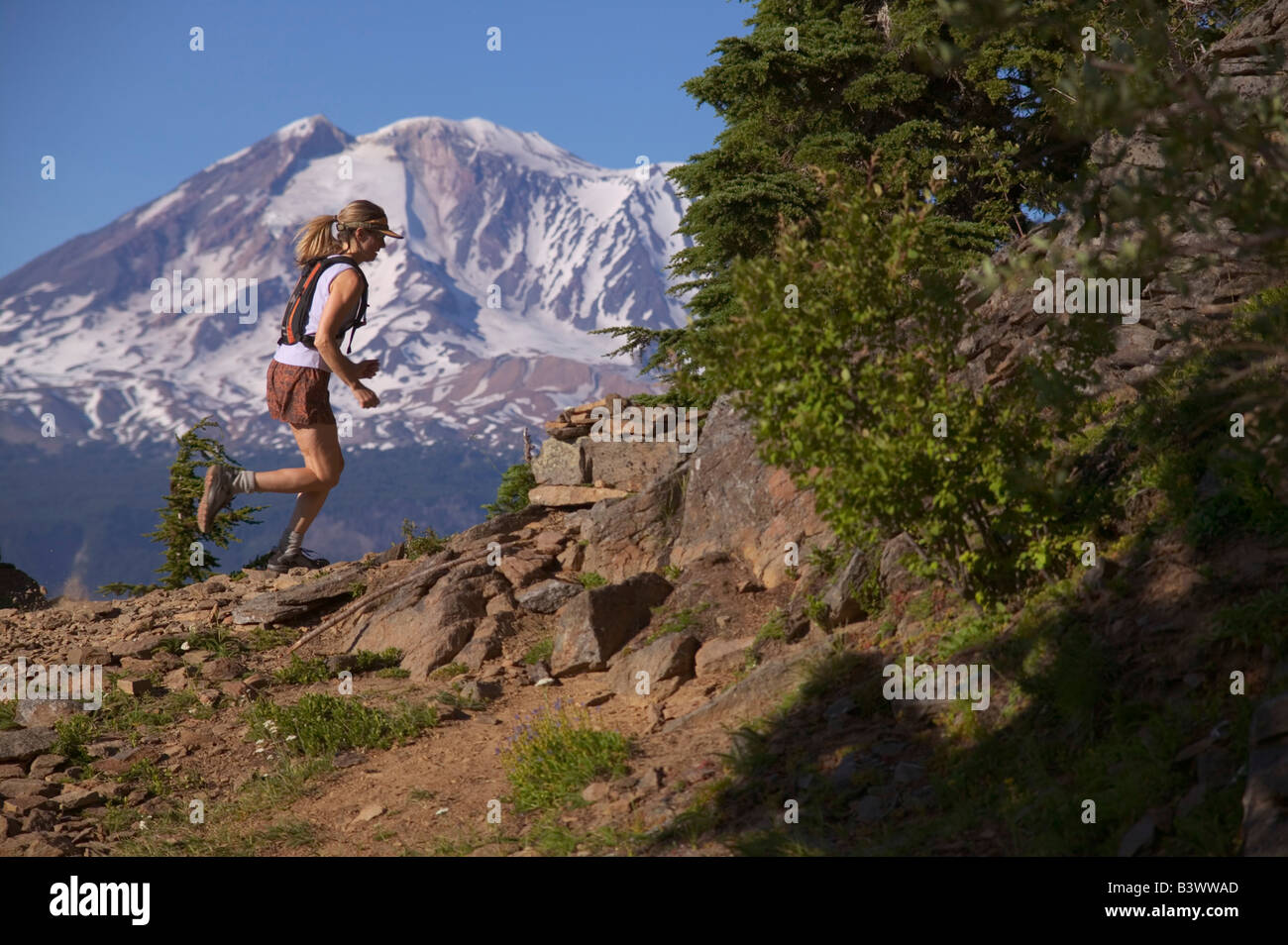 Side profile of a woman running on a mountain, Mt Adams, Washington State, USA Stock Photo