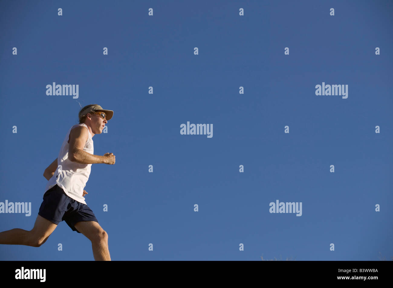 Low angle view of a man running Stock Photo