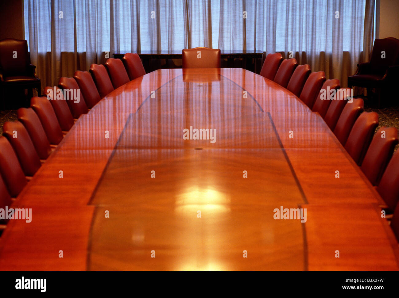 Elaborate board room table and chairs in a corporate office Stock Photo