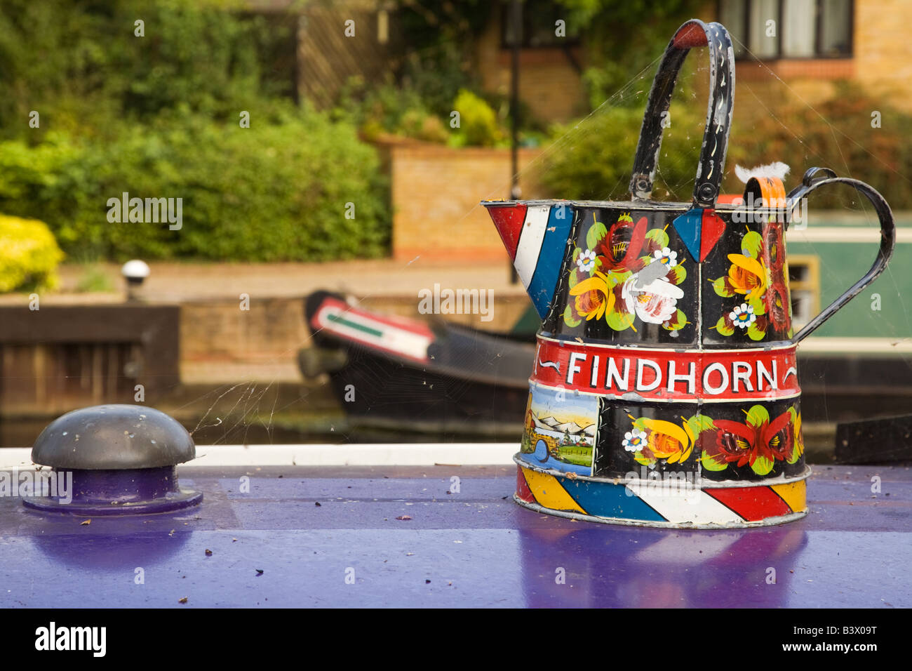 A Decorative Metal Watering Can In Canal Art On The Roof Of A