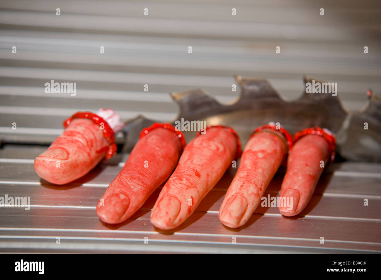 Imitation fake Severed fingers after circular saw accident Stock Photo