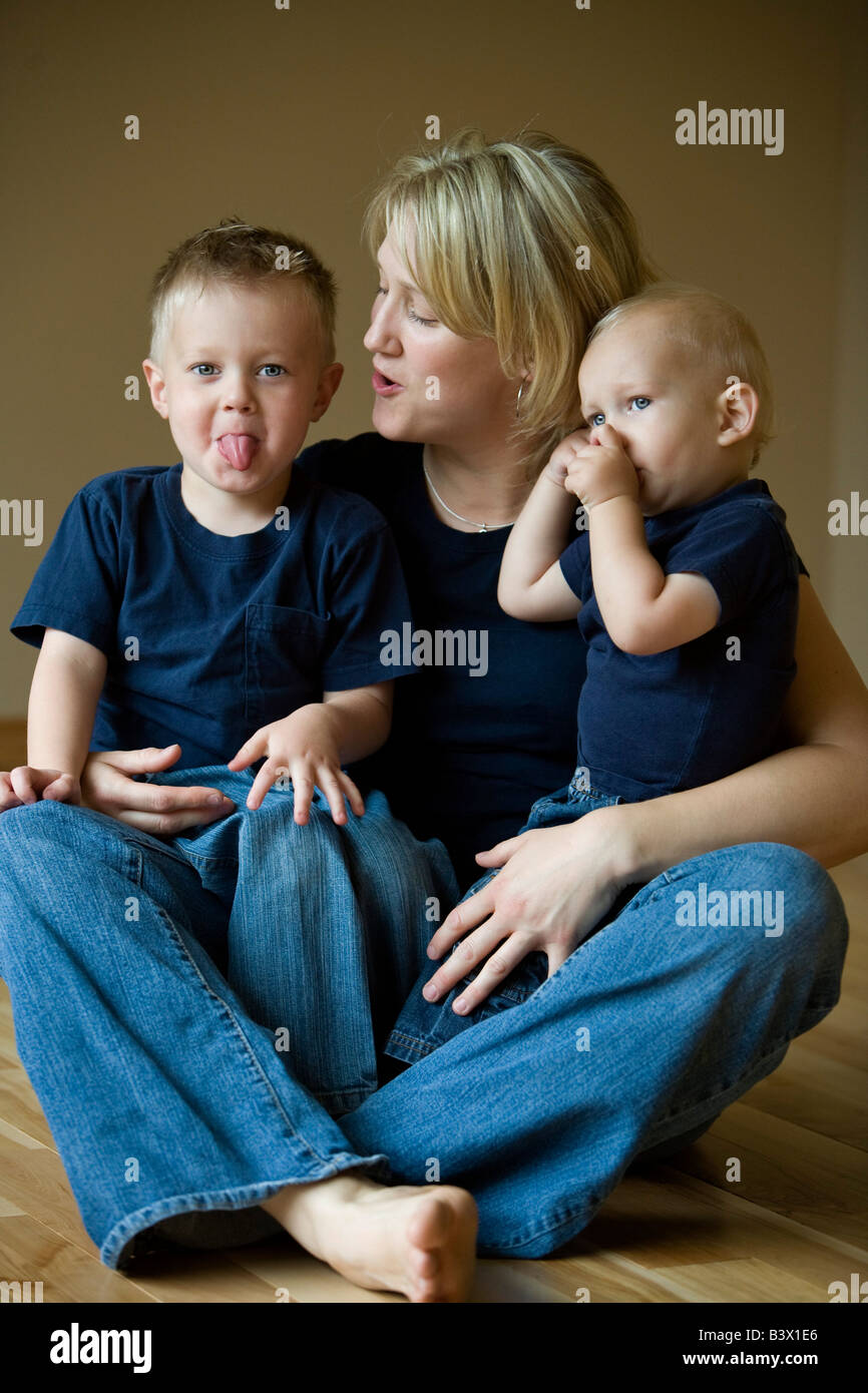 A mother with two sons Stock Photo