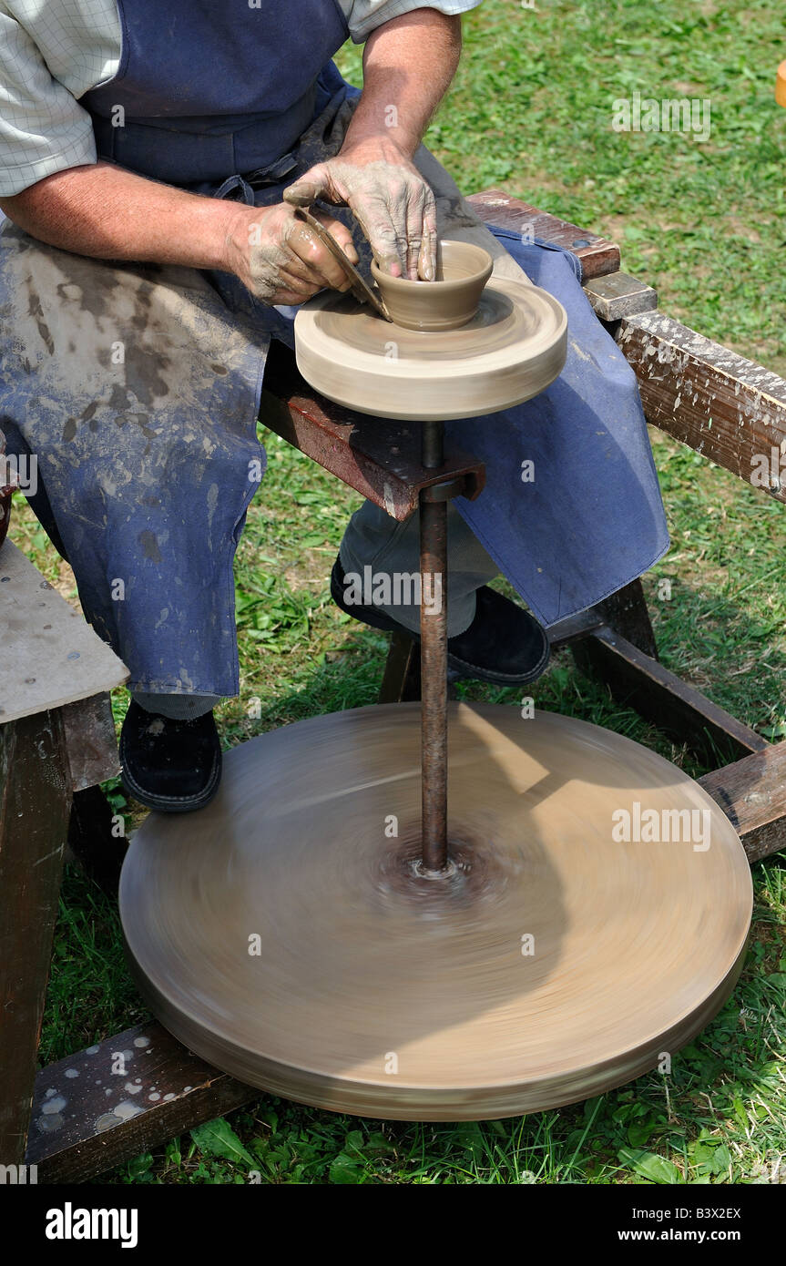 Potter with potter's wheel in action Stock Photo Alamy