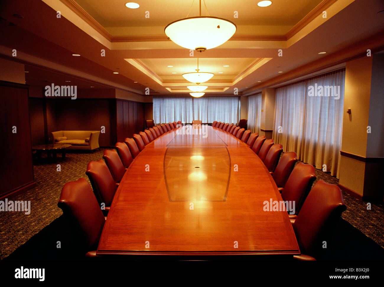 Elaborate board room table and chairs in a corporate office Stock Photo