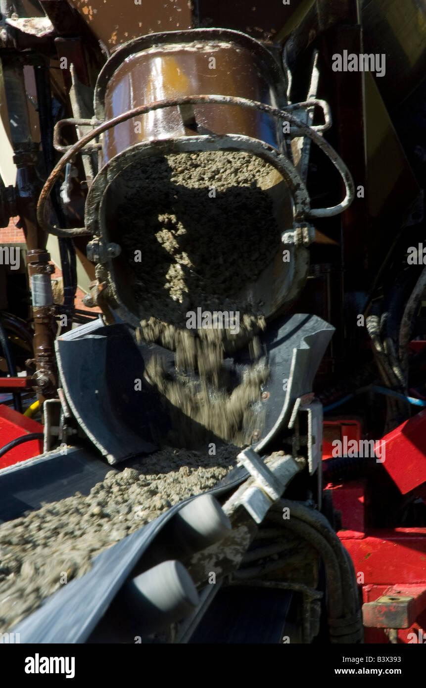 A cement concrete mixer pours concrete into the raft screed Stock Photo