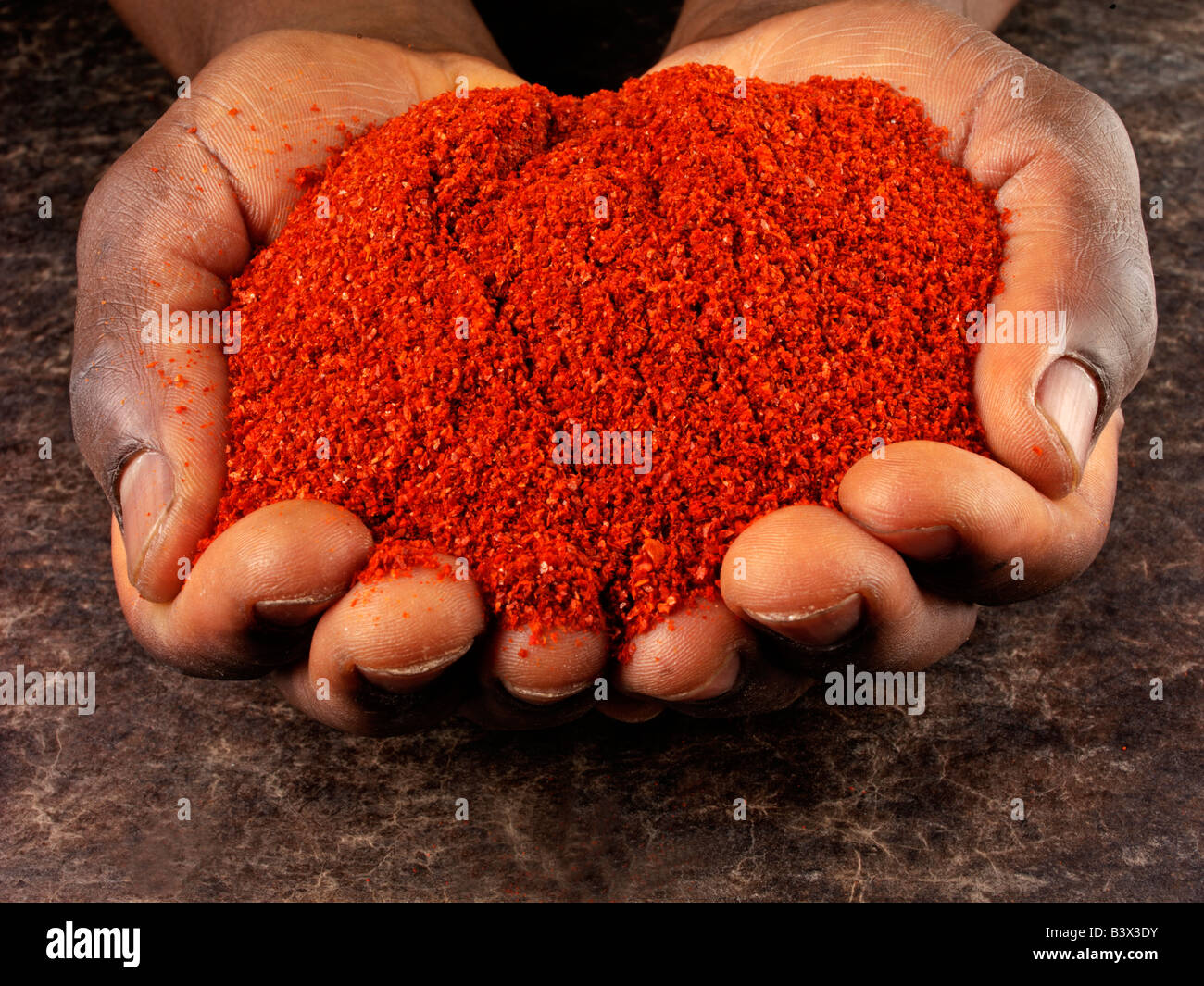 Chilli powder hand hi-res stock photography and images - Alamy