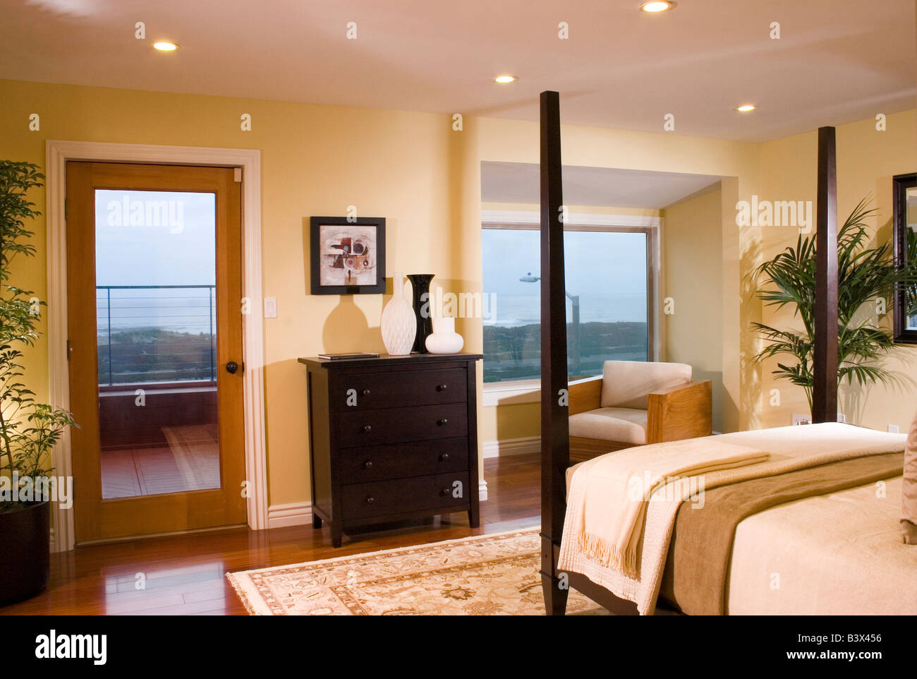 Master bedroom with a deck and a view of the Pacific Ocean in a San ...
