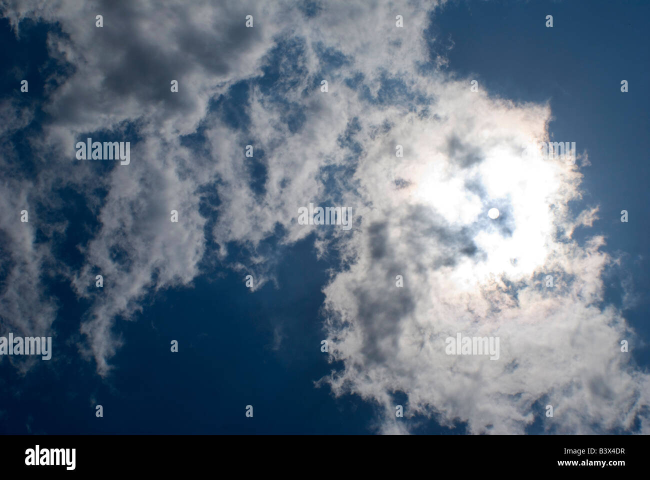 The sun shining through clouds Stock Photo - Alamy