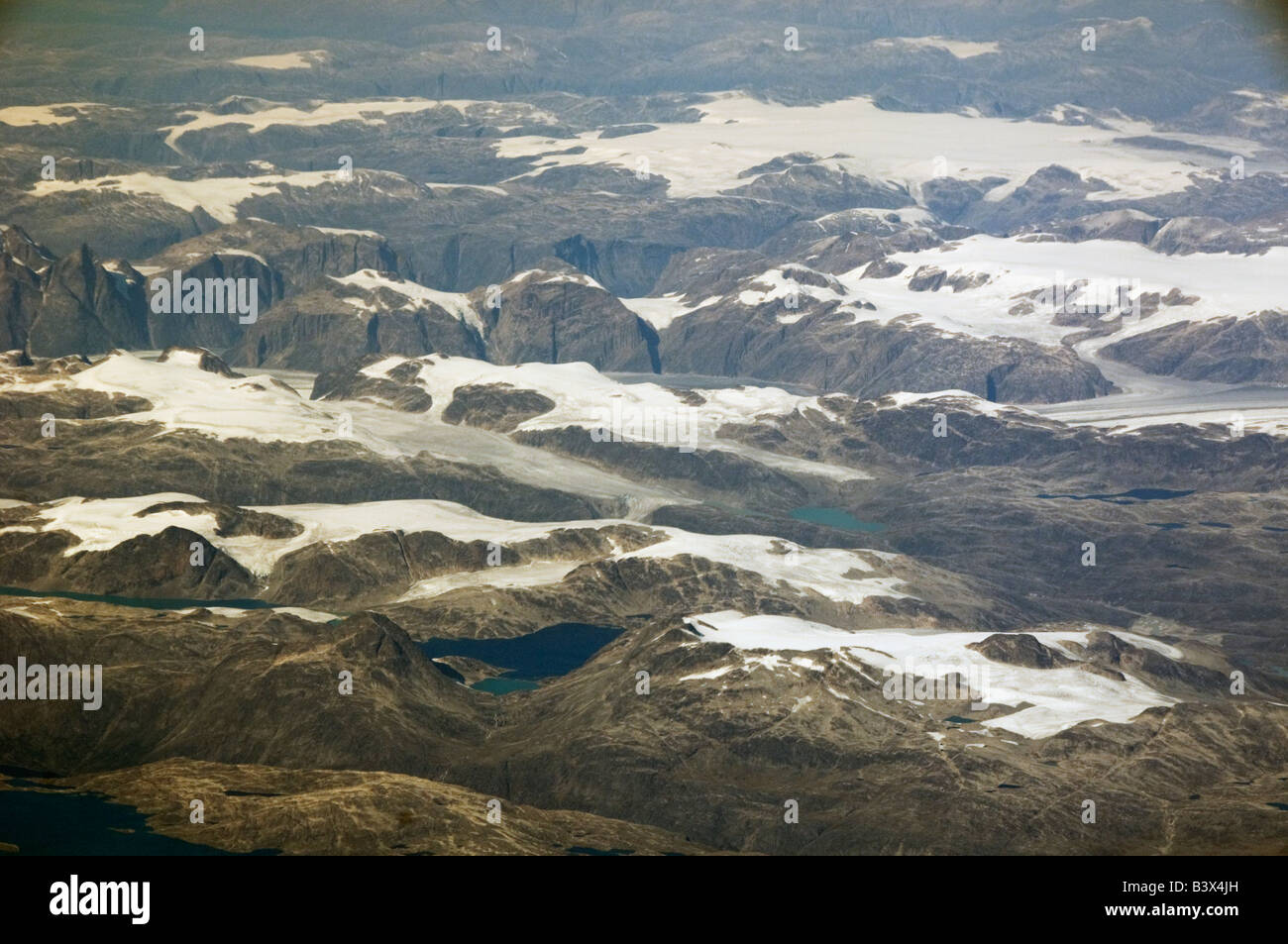Greenland glaciers and mountains, west coast, AERIAL, from Commercial Jet Stock Photo