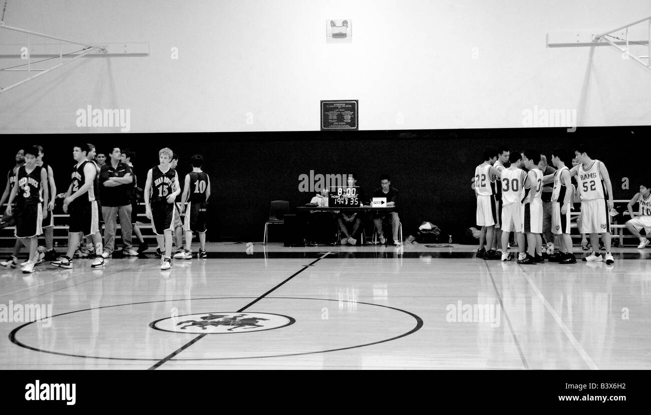 High school basketball teams huddle. Stock Photo