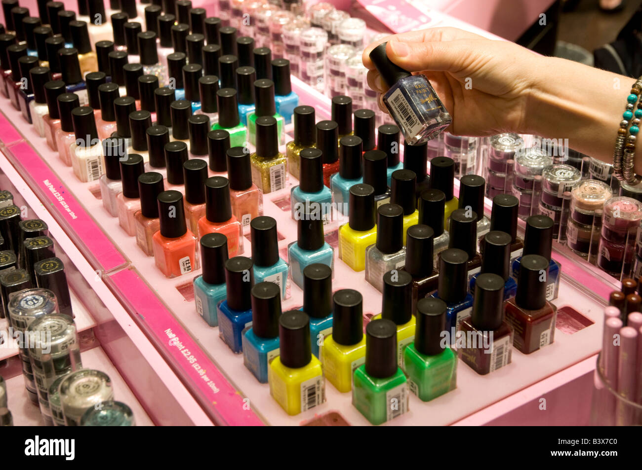 Buying coloured nail varnish in a shop England UK Stock Photo Alamy