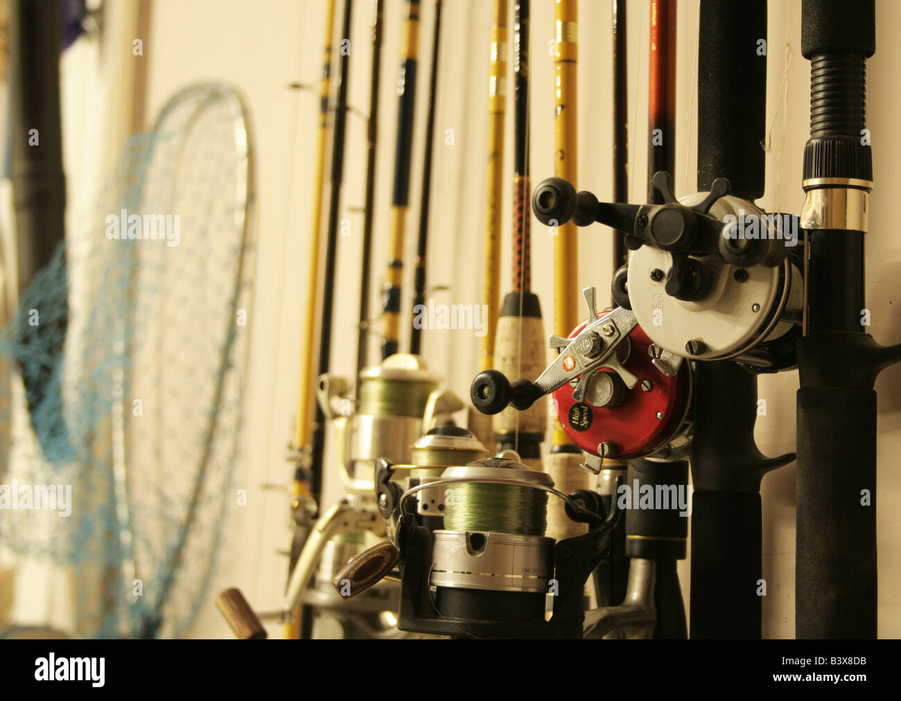 Fishing rods on holder in garage Stock Photo Alamy