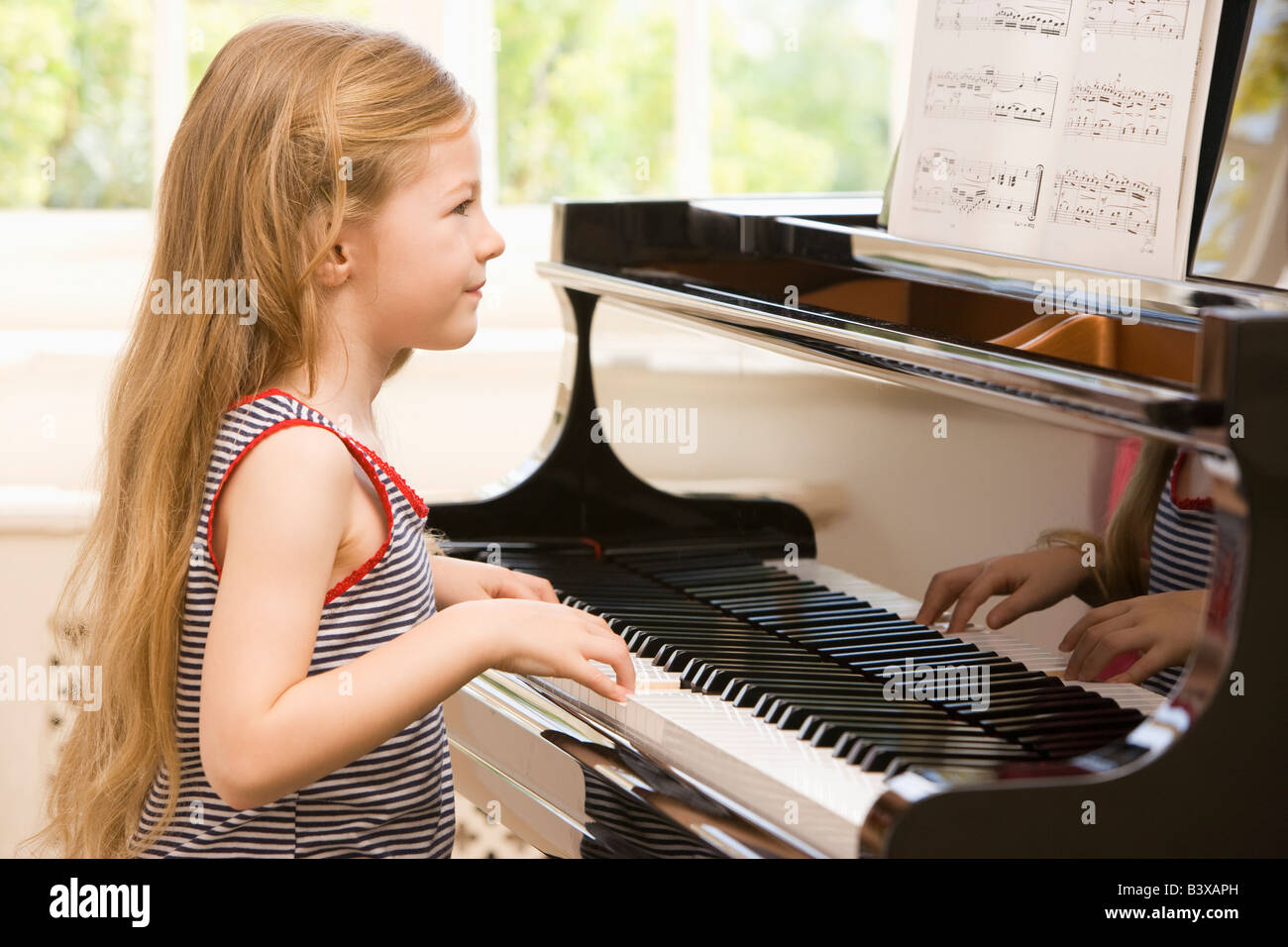 Young Girl Playing Piano Stock Photo - Alamy