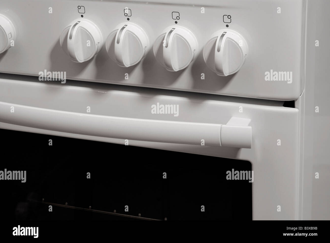 White freestanding gas cooker closeup Stock Photo Alamy