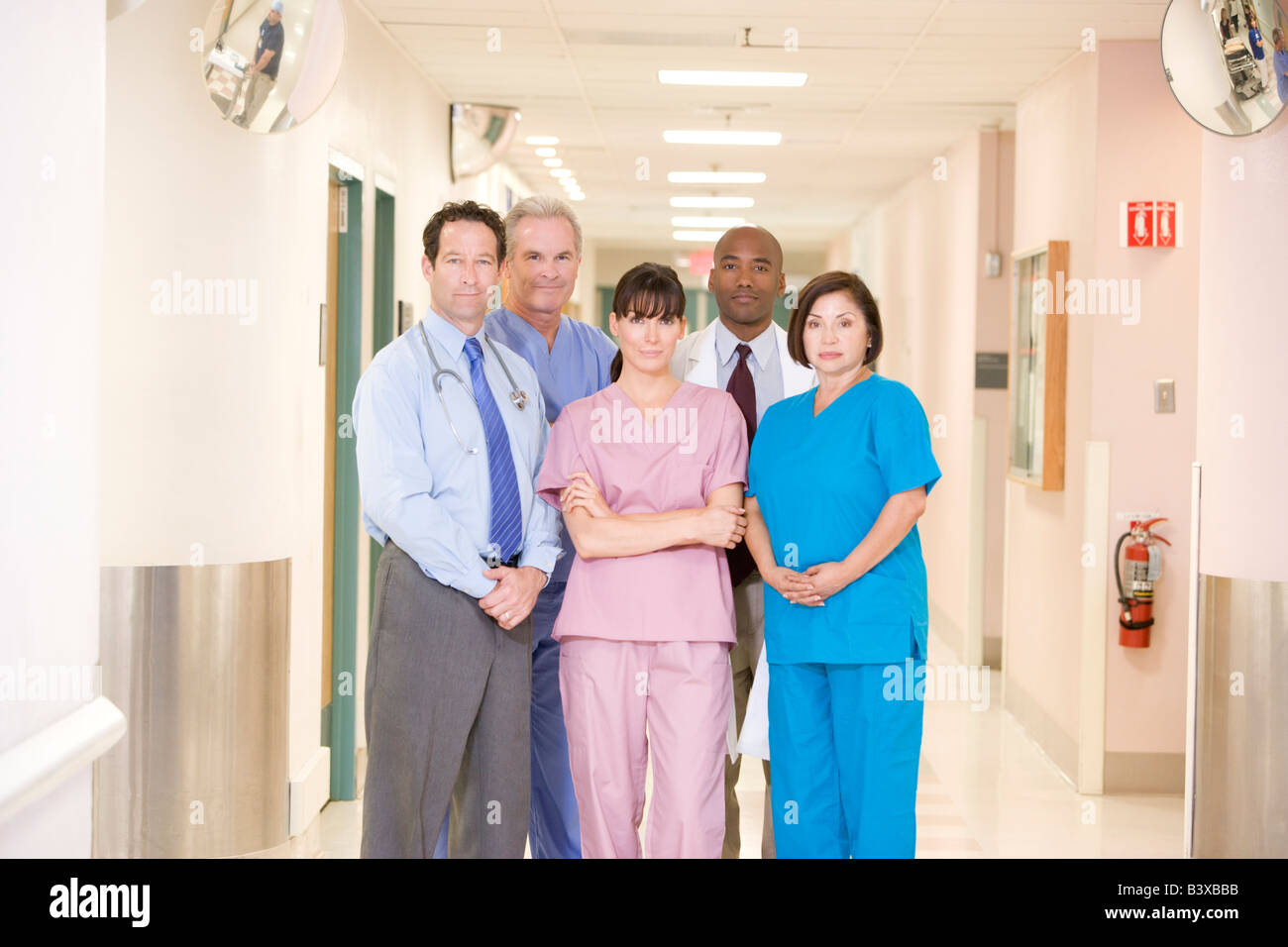 Hospital Team Standing In A Corridor Stock Photo - Alamy