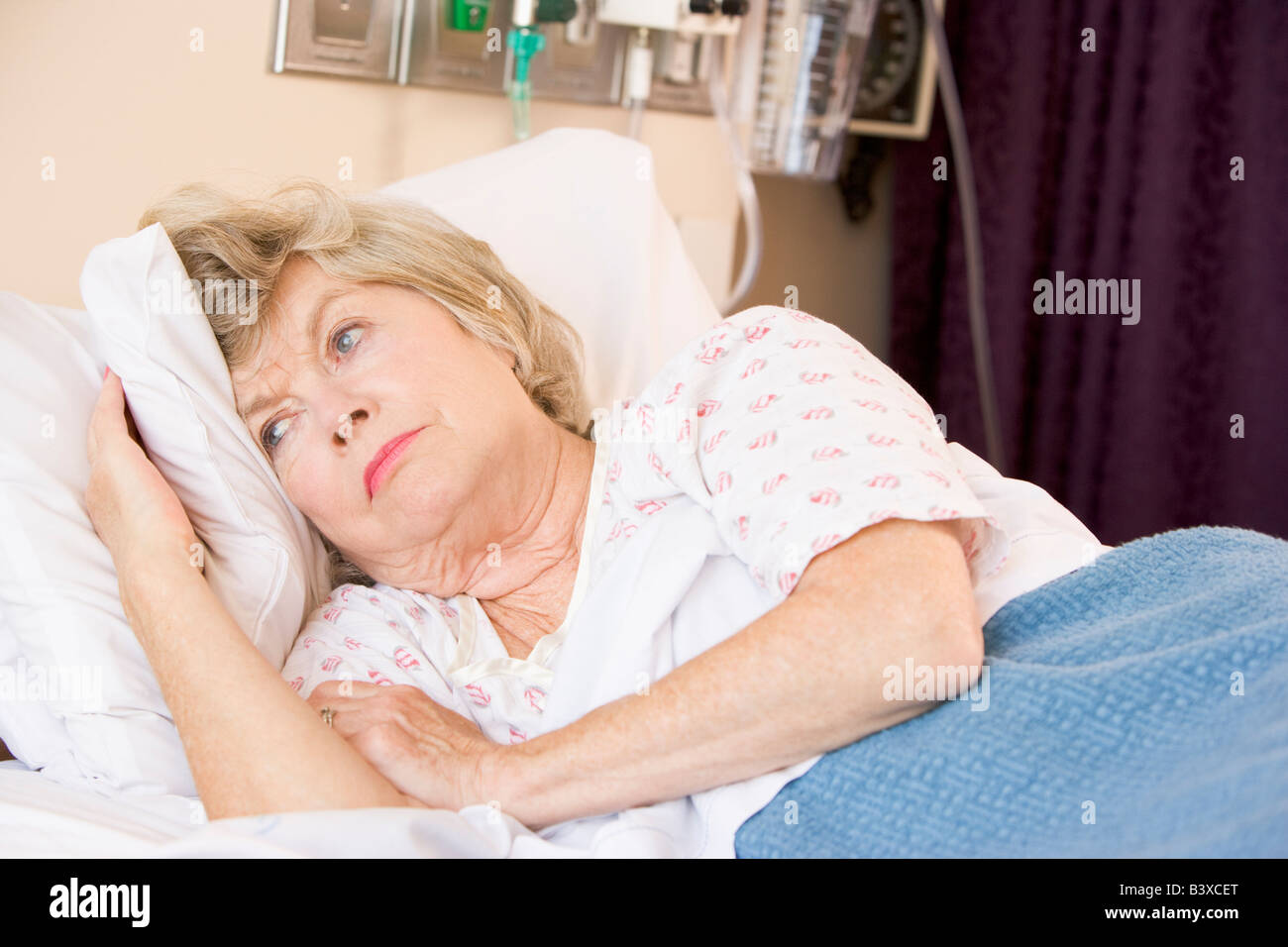 Senior Woman Lying In Hospital Bed Stock Photo Alamy